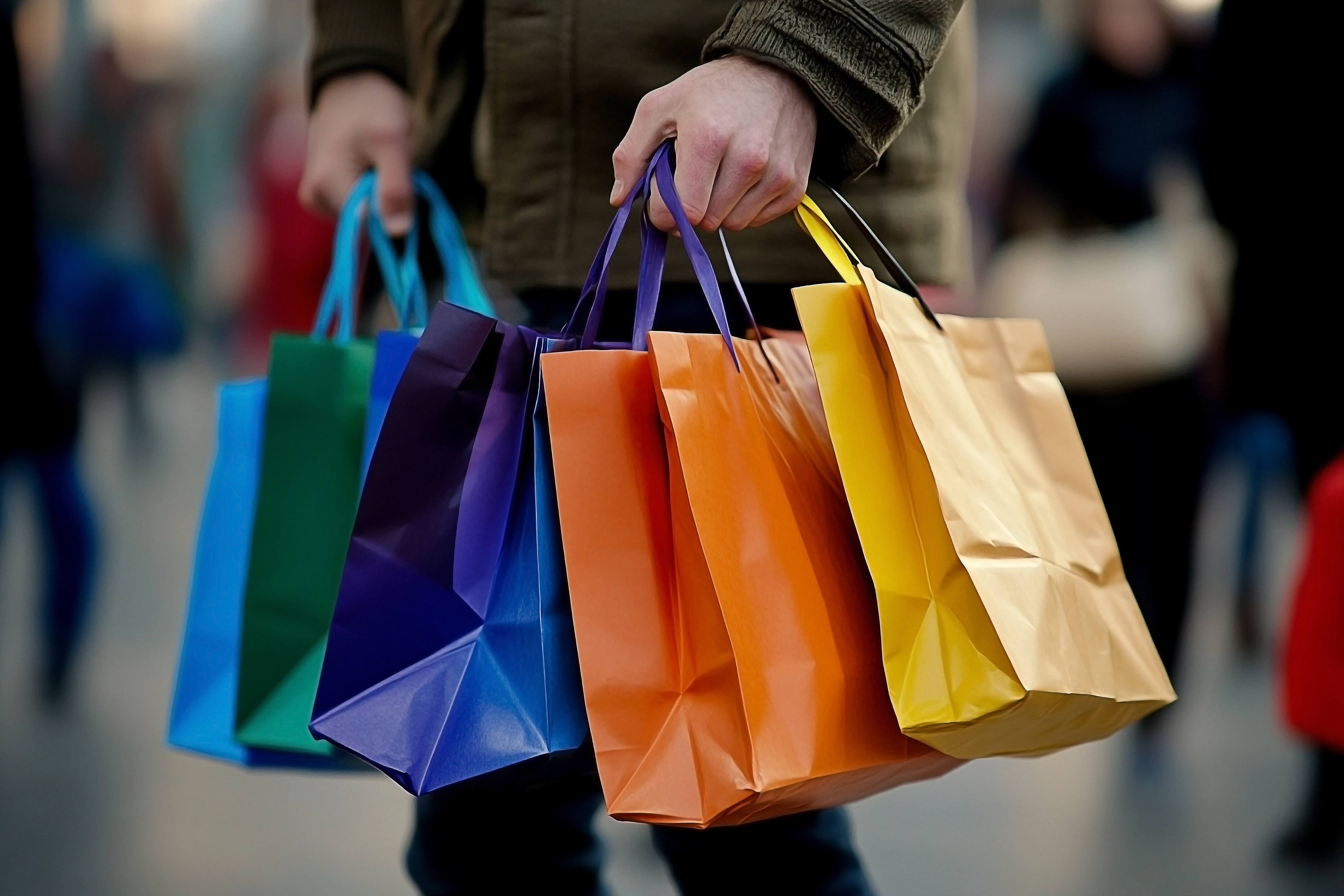 A picture of a person holding shopping bags